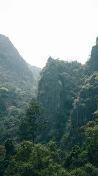Green fields with luxurious mountain in the background, Thakhek loop, Laos Stock Photos