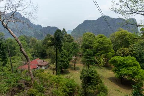 Green fields with luxurious mountain in the background, Thakhek loop, Laos Stock Photos