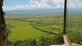 Green fields, mountains and cloudy sky seen from hotel window, beautiful nature HD Footage