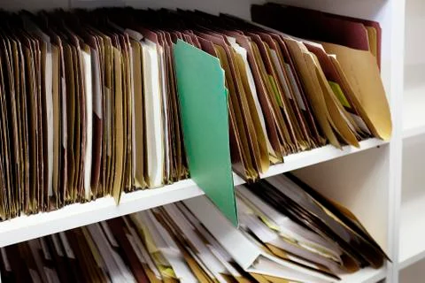 Green File Folder with Other Files for Business Organizing and Administration Stock Photos