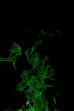 Green fire on black background Stock Photos