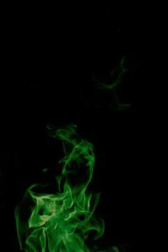Green fire on black background Stock Photos