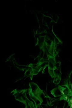 Green fire on black background Stock Photos