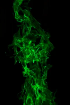 Green fire on a black background Stock Photos