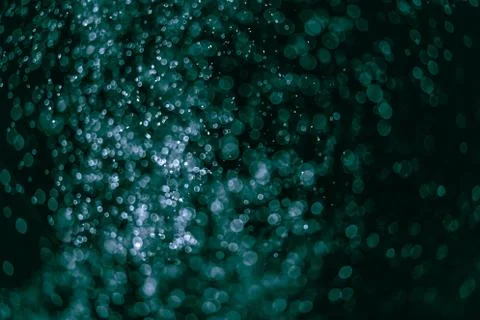 Green fire forms ember abstraction in black background Stock Photos