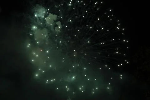 Green firework in the sky Stock Photos