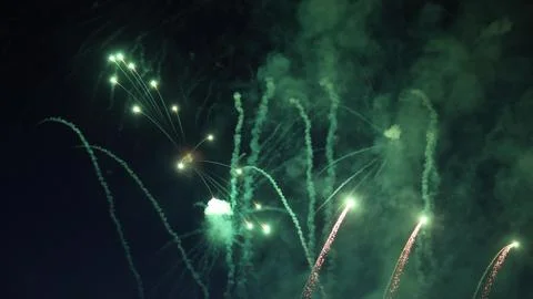 Green fireworks exploding in the night sky Stock Photos