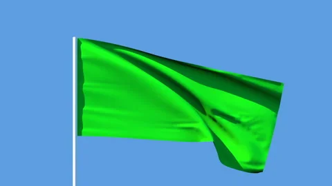 Green flag on a blue background. Green color symbolizes the movement of Stock Footage 129169849