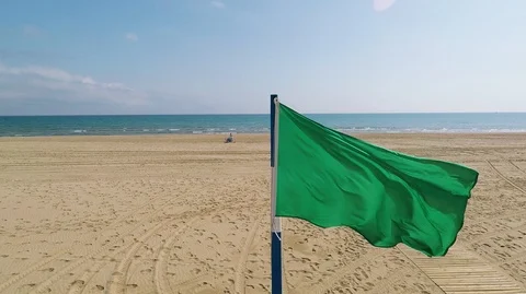 Green flag on the Mediterranean beach Видео 93830201