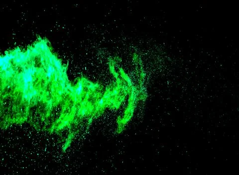 Green flame explosion texture on black background. Abstract background Stock Photos