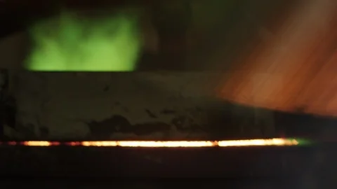 Green flames come out of oven in foundry Stock Footage 105886547