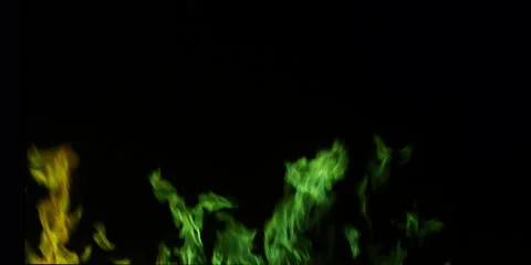 Green flames swirling upward from below a black frame Stock Footage 59122014