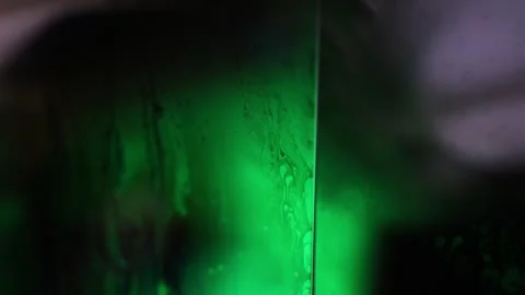 Green flat liquid surface reflection, dark absorption Stock Footage 298709581