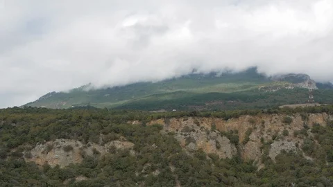 Green forest mountain with clouds on the top Stock Footage 121575898