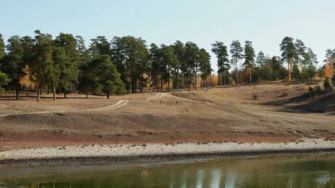 Green forest of pine tree reflect on the water surface, Stock-Footage 140911979