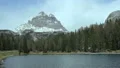 Green forest surrounding mountain lake in Dolomites, cloudscape, time lapse HD Footage