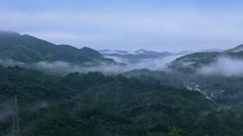 Green forests shrouded in clouds and mist in the mountains of southern Anhui Stock-Footage 347481665