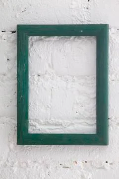 Green frame on white  wall Stock Photos