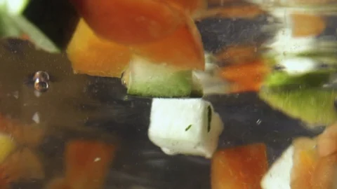 Green fresh broccoli in a closeup view as clean liquid water sprays over the Stock Footage 102585341