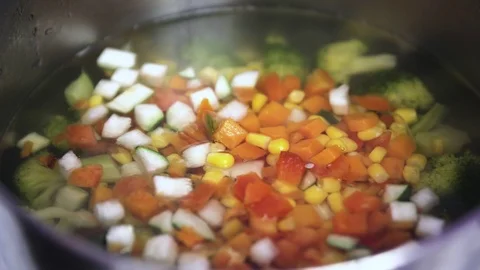 Green fresh broccoli in a closeup view as clean liquid water sprays over the Stock Footage 102586312