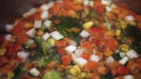 Green fresh broccoli in a closeup view as clean liquid water sprays over the Stock Footage 102586483