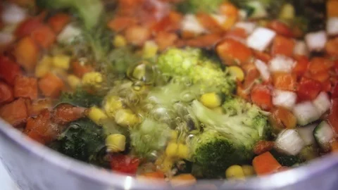 Green fresh broccoli in a closeup view as clean liquid water sprays over the Stock Footage 102586601