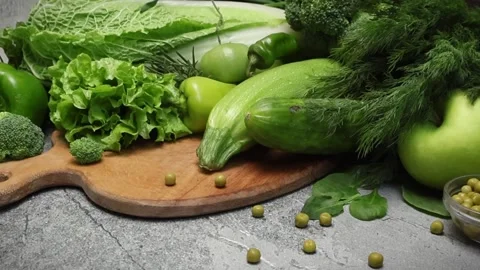 Green fresh vegetables on a cutting board Stock Footage 294750684