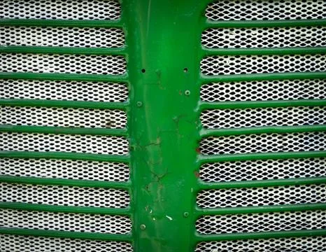 Green front mask of the engine of the tractor Stock Photos
