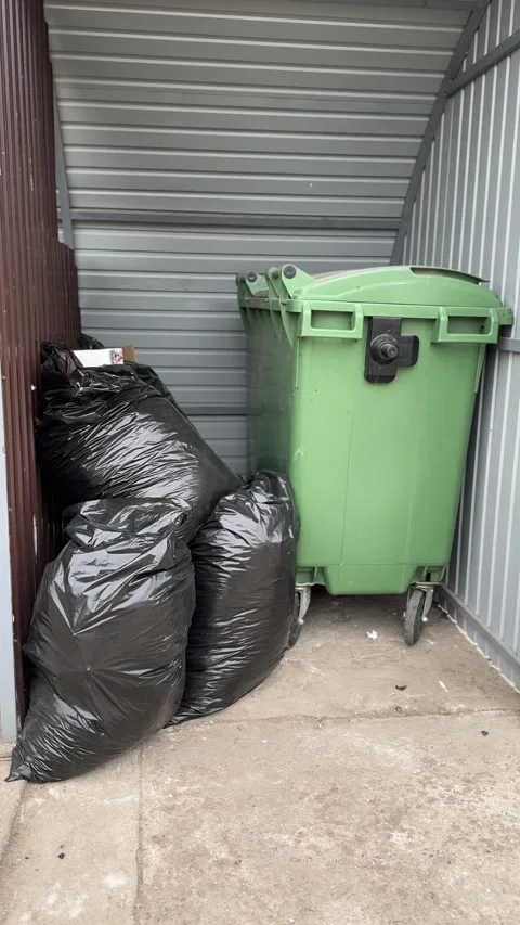 Green garbage can is used for waste containment and garbage collection located Vidéo 316806889