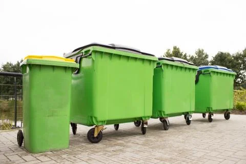 Green garbage containers in a row Foto stock