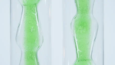 Green gel into test tubes.  Stock Footage 270163438