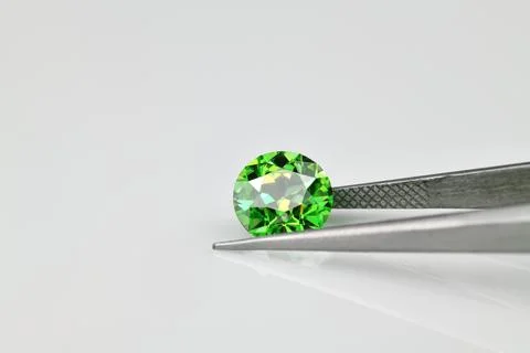 A green gemstone is on a white background 写真素材