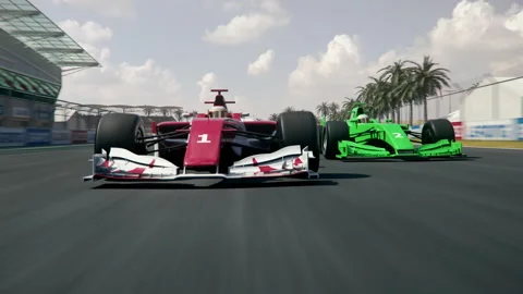 Green generic formula one race car is trying to overtake the leading car Stock Footage