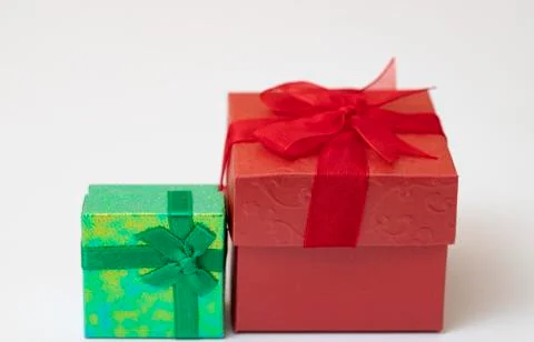 Green gift box with Red gift box and ribbon isolated on white background. Stock Photos