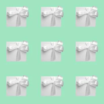 Green gift boxes on green background. Seamless pattern, holiday concept . Stock Photos