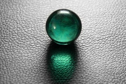 Green glass ball on ?????? ??????? background Stock Photos
