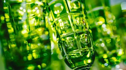 Green glasses in a row - texture with light behind Foto stock