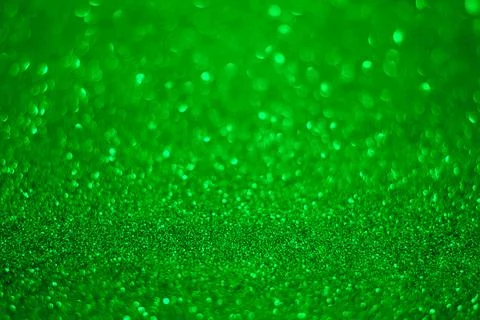 Green glitter background. Texture of the green glitter particles. Stock Photos
