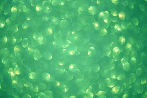 Green glitter blurred abstract background. Green defocus light sparkles. Stock Photos