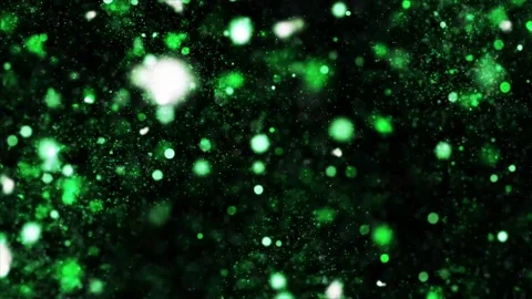 Green Glitter Dust Particles Floating Through Dark Space with Sparkling Bokeh Stockbeeldmateriaal 336746885