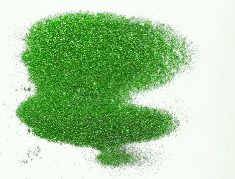 Green glitter on light background - macro photo Stock Photos