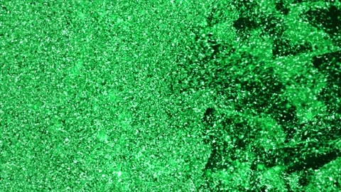 Green glitter particle movement creating a rich shimmering texture with sparkle Stock Footage 335893847