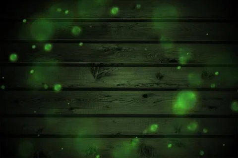 Green glowing bokeh lights on dark wooden wall Ilustración de archivo