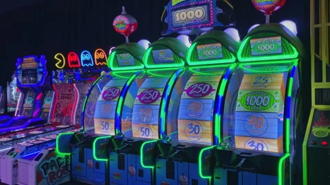Green glowing frog themed ticket redemption big bass wheel arcade games  dave-13 Stock Footage 339492642