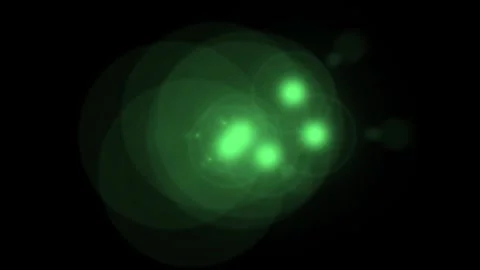 Green glowing particles in motion against a dark background with subtle cin.. Video stock 341664989