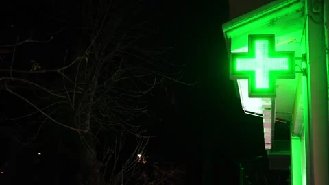 The green glowing pharmacy cross Stock Footage 323010308