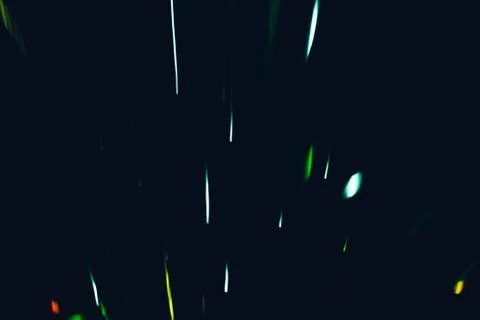 Green glowing strokes falling firework sparkles Stock Photos