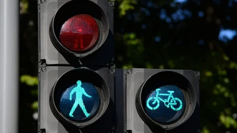 Green go and red stop warning symbols for pedestrians and cyclists UK Stock Footage 78633283