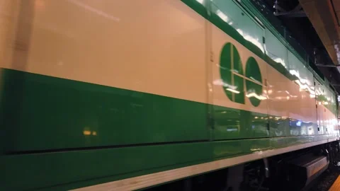 Green GO Transit double-decker train operate from Union Station. Stock Footage 314332133