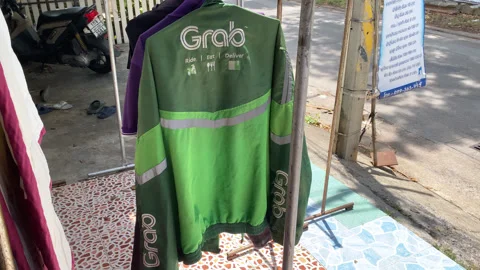 Green Grab Jacket Uniform Hang Dry On Clothes Line After Cleaned, Washed At Home Stock-Footage 247458830